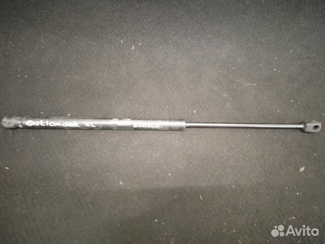 Амортизатор багажника задний Mitsubishi Outlander